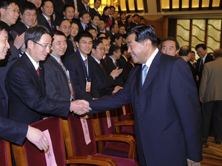 Jia Qinglin (R, front), chairman of Chinese People's Political Consultative Conference (CPPCC) National Committee, who is also a member of the Standing Committee of Communist Party of China (CPC) Central Committee Political Bureau, meets with delegates to the Fifth Overseas Chinese Forum Worldwide in Beijing Oct. 29, 2008.
