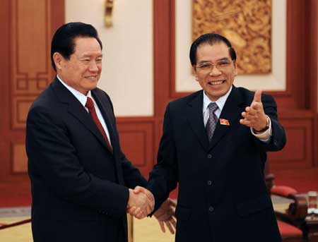  Zhou Yongkang (L), member of the Standing Committee of the Political Bureau of the Communist Party of China (CPC) Central Committee and the secretary of the CPC Central Political and Legislative Affairs Committee (CPLAC), shakes hands with Nong Duc Manh, general secretary of the Communist Party of Vietnam (CPV) Central Committee, during their meeting in Hanoi, capital of Vietnam, on Oct. 30, 2008.