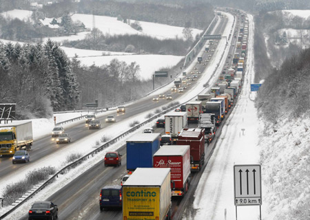 Cars and trucks drive on a motorway after snowfalls in the western town of Gevelsberg Jan. 5, 2009.