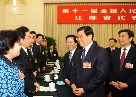 Chinese leaders joined deputies to the National People's Congress (NPC), the country's top legislature, in deliberating the government work report by Premier Wen Jiabao Thursday, calling for concerted efforts to overcome difficulties and achieve fresh development.