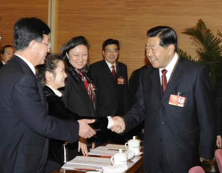 Chinese leaders joined deputies to the National People's Congress (NPC), the country's top legislature, in deliberating the government work report by Premier Wen Jiabao Thursday, calling for concerted efforts to overcome difficulties and achieve fresh development.