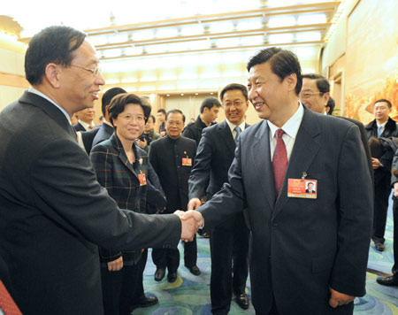 Chinese leaders joined deputies to the National People's Congress (NPC), the country's top legislature, in deliberating the government work report by Premier Wen Jiabao Thursday, calling for concerted efforts to overcome difficulties and achieve fresh development.