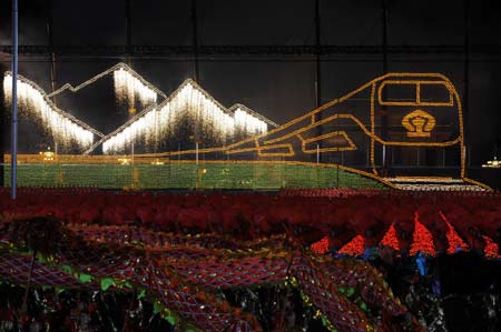 The fireworks portraying a train running on the Qinghai-Tibet Railway lights the Tian'anmen Square during the grand evening gala celebrating the 60th anniversary of the founding of the People's Republic of China, in Beijing, capital of China, Oct. 1, 2009. (Xinhua/Li Ga)