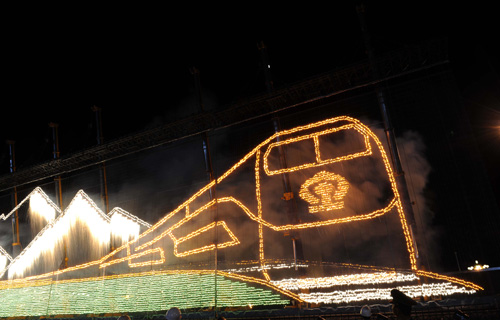 fireworks dportraying a train running on the Qinghai-Tibet Railway lights the Tian'anmen Square during the grand evening gala celebrating the 60th anniversary of the founding of the People's Republic of China, in Beijing, capital of China, Oct. 1, 2009. 