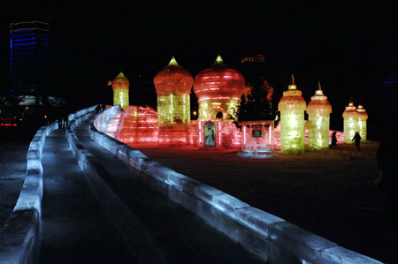 Tourists visit at the Harbin Ice Lantern Festival in Harbin, northeast China's Heilongjiang Province, on Dec. 20, 2009. Authorized by Walt Disney Company, this year's festival is able to use Disney characters and build up an ice and snow Disney world. (Xinhua/Wang Song)