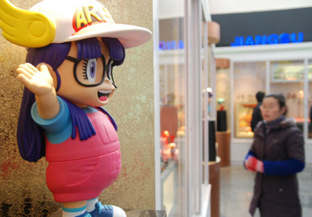 A visitor views a cartoon model at the Wuxi Animation & Toys Museum in Wuxi, east China's Jiangsu Province, Jan. 4, 2009. The museum was open to public on Monday.