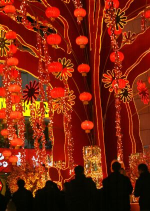 Red lanterns are seen around the trees and buildings on a street in Suzhou, east China's Jiangsu Province, Jan. 14, 2010, to add festive atmosphere as the Spring Festival draws near.