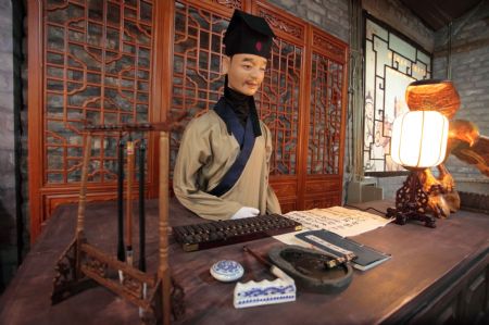 Photo taken on Jan. 16, 2010 shows the interior display of the Imperial Granary Museum of Ming Dynasty of Nanxingcang Barn, which has been opened to public visitors, in downtown of Beijing. Affluent exhibits reenacting the history of grains transport through the Grand Canal and the imperial barns storage are accessible to visitors, who can also experience the quern of stone mill some 600 years ago. (Xinhua/Luo Wei)