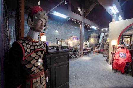 Photo taken on Jan. 16, 2010 shows the interior display of the Imperial Granary Museum of Ming Dynasty of Nanxingcang Barn, which has been opened to public visitors, in downtown of Beijing. Affluent exhibits reenacting the history of grains transport through the Grand Canal and the imperial barns storage are accessible to visitors, who can also experience the quern of stone mill some 600 years ago. (Xinhua/Luo Wei)