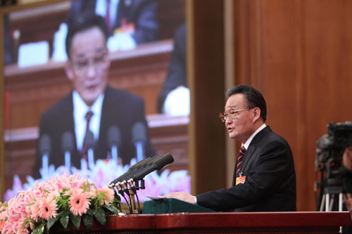 Wu Bangguo, chairman of the Standing Committee of the National People's Congress (NPC), delivers a work report of the Standing Committee of the NPC during the third plenary meeting of the Third Session of the 11th NPC at the Great Hall of the People in Beijing, capital of China, March 9, 2010.