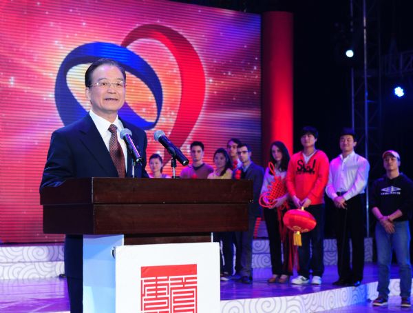 Chinese Premier Wen Jiabao (L) addresses the opening ceremony of the EU-China Year of Youth in Beijing, capital of China, Feb. 23, 2011. (Xinhua/Zhang Duo) (xzj)  