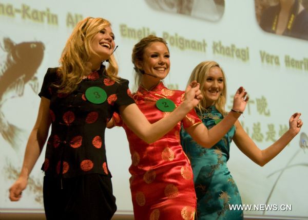 Middle school students sing a Chinese song during the 'Chinese Bridge' Chinese language competition of Swedish middle school and university students in Stockholm, capital of Sweden, April 10, 2011. Fifty-one students from across Sweden took part in the competition on Sunday.  (Xinhua/Wu Ping) 
