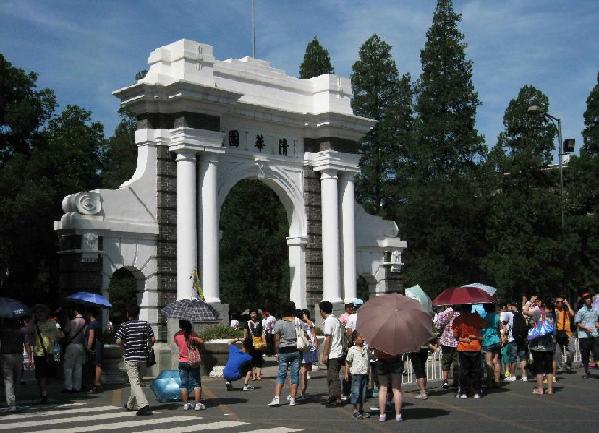Tourist visit the campus of Tsinghua University in Beijing, capital of China, July 31, 2011. The quantity of tourists stood on a high level in this summer vacation opening period of Tsinghua University. [Xinhua/Zhang Yanhui]