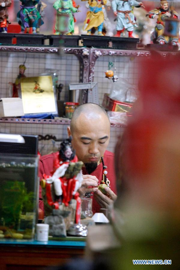 Folk artist and his dough figurines