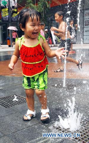 A little girl cools off at a fountain in Shenyang, capital of northeast China's Liaoning Province, Aug. 5, 2011. The city is experiencing a hot summer, with the highest temperature reaching 31 degrees Centigrade on Friday. (Xinhua/Yang Qing) 